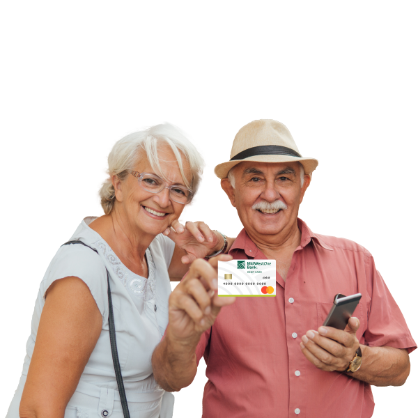 Female with light skin and white hair wearing a blue short sleeve shirt smiling next to male with light skin wearing a tan hat and red button down shirt holding MidWestOne Bank debit card