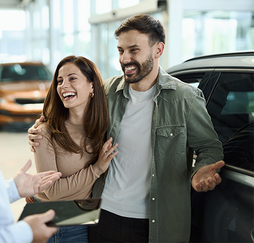 middle age couple purchasing new car