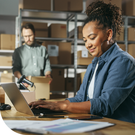 small business partners looking at computer