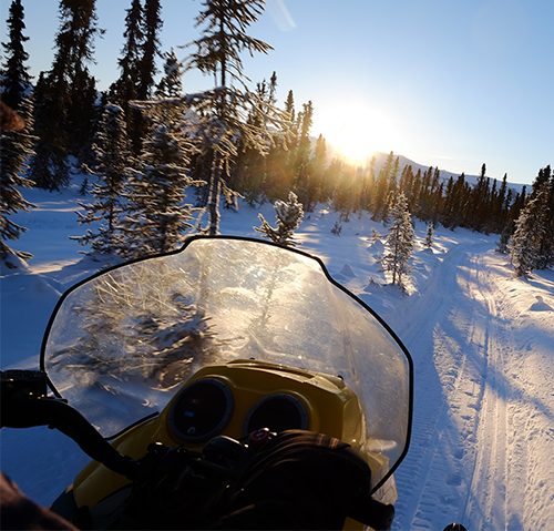 rides on 4-wheeler on dusty road