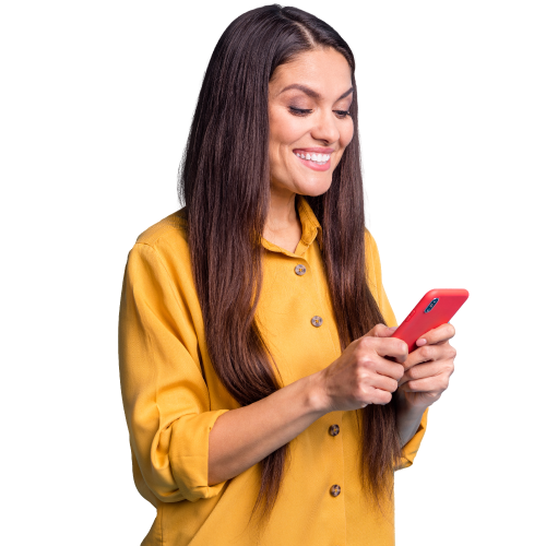 Woman with light skin and dark brown hair wearing a button down yellow shirt smiling holding red phone