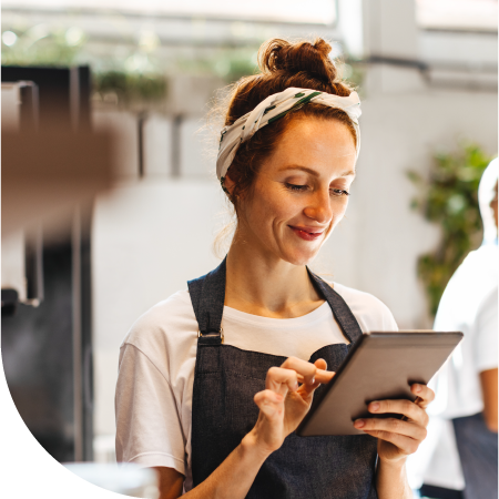 female business owner holding tablet
